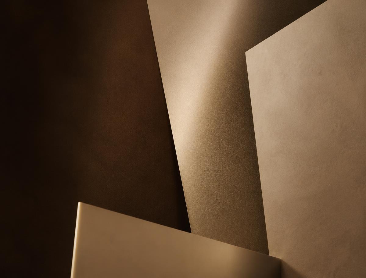 Abstract layered warm paper planes in espresso and champagne tones